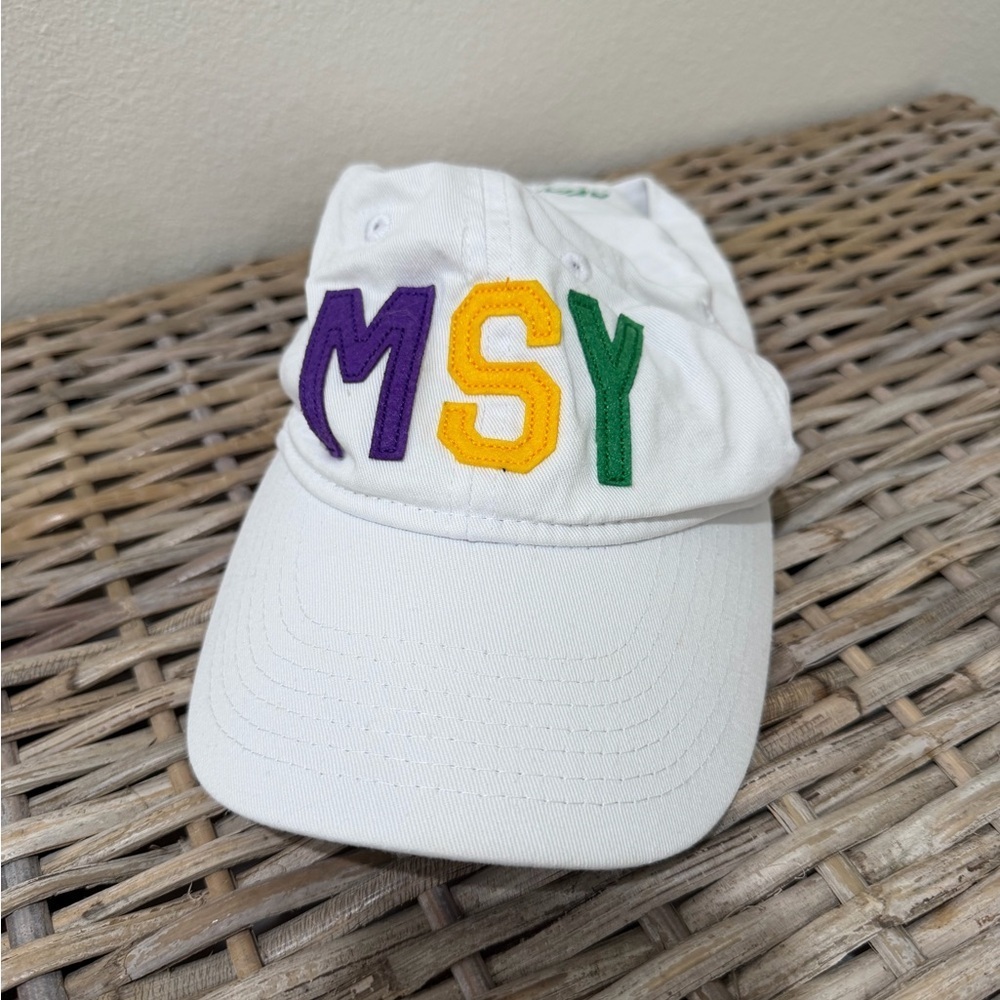 Aviate White Cap with Mardi Gras colors MSY Embroidery, one size fits most.